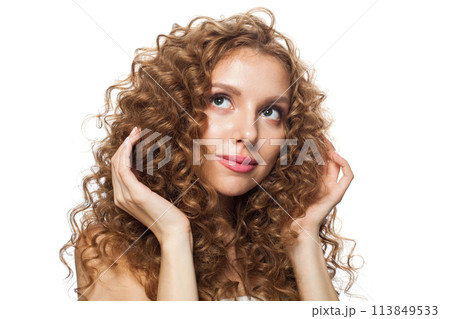Cheerful woman face. Young model with healthy skin, long hair and makeup on white background 113849533