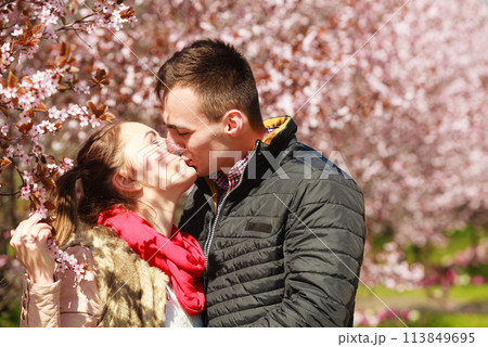 Couple in love walking in park at sunny spring day Couple in love walking in park at sunny spring day 113849695