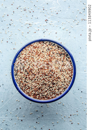Quinoa mix. Mixed white, red and black quinoa seeds in a bowl 113849902