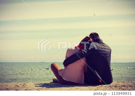 Happy couple having date on beach Happy couple having date on beach 113849931