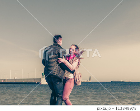 Happy couple having date on beach 113849978