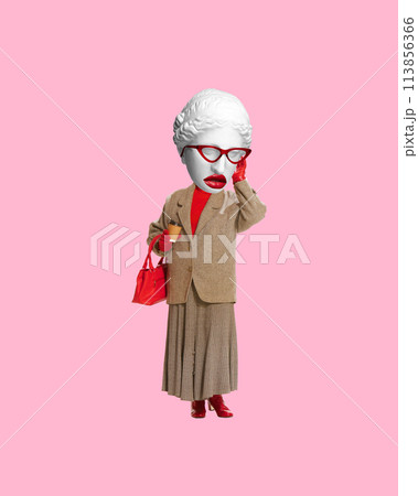 Woman with antique statue head, in glasses, coat, red purse, against a pink background. Contemporary art collage. Timeless elegance with modern twist. 113856366