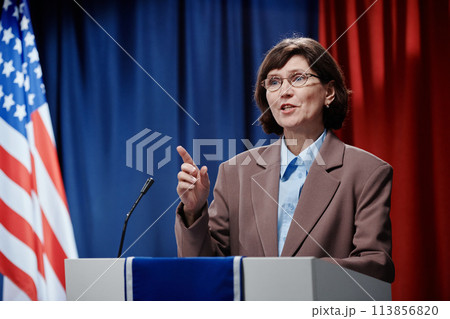 Female minister speaking to audience Female minister speaking to audience 113856820