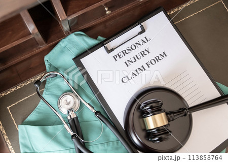 Medical Claim Form with Stethoscope on Doctor's Desk. 113858764