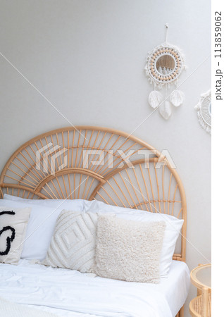 White pillows on wooden weave bed in minimal bedroom interior. Real photo White pillows on wooden weave bed in minimal bedroom interior. Real photo 113859062