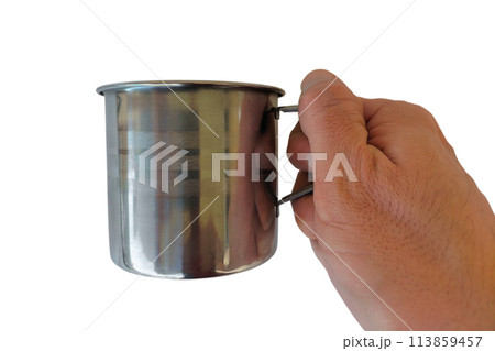 Metal tourist mug in right hand of man isolated on white background. Blank for tourist advertising posters against the background of mountains, natural landscapes, river, valley, forests 113859457