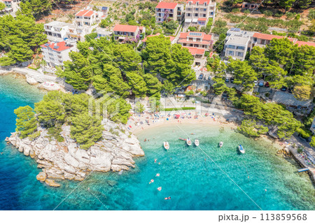 Aerial view of Punta Rata beach with boats and azure sea in Brela, Croatia, Dalmatia, Croatian azure coast 113859568