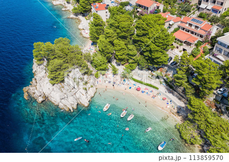 Aerial view of Punta Rata beach with boats and azure sea in Brela, Croatia, Dalmatia, Croatian azure coast 113859570