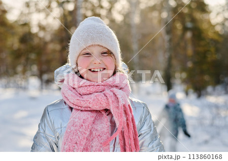 Laughing girl in warm winterwear 113860168
