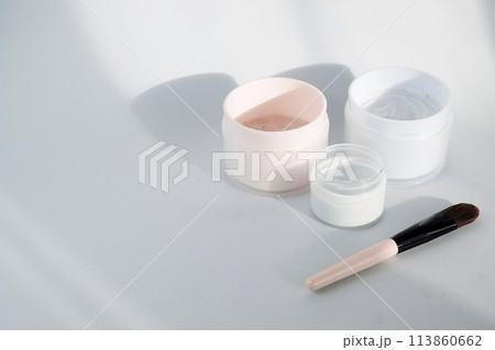 Flat lay with blue clay facel mask in jar. Beauty background with facial cosmetic products. Spa concept. Beauty blogger, salon treatments concept. Minimalism. Flat lay with blue clay facel mask in jar. Beauty background with facial cosmetic products. Spa concept. Beauty blogger, salon treatments concept. Minimalism. 113860662