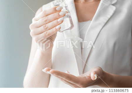 Women washing hands with antibacterial sanitizer gel. Hygiene concept. Prevent the spread of germs and bacteria and avoid infections corona virus Women washing hands with antibacterial sanitizer gel. Hygiene concept. Prevent the spread of germs and bacteria and avoid infections corona virus 113860675