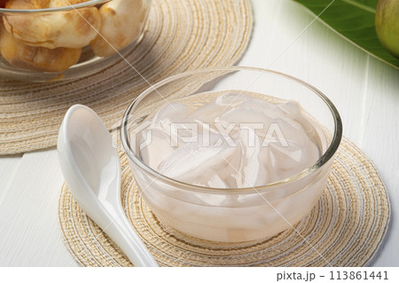 Toddy Palm in Syrup,Sliced sweet fresh Palmyra palm with syrup in glass bowl,Thai dessert for hot summer (Luk Tarn Loi Kaew) 113861441