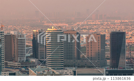 Dubai's business bay towers at morning aerial timelapse. 113861636