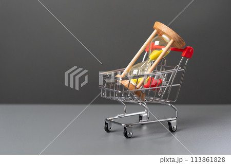 Hourglass in a shopping cart. Find balance to get the most out of each. Investing money can save you time. Fulfilling life and financial security. Hourly wages. Hourglass in a shopping cart. Find balance to get the most out of each. Investing money can save you time. Fulfilling life and financial security. Hourly wages. 113861828