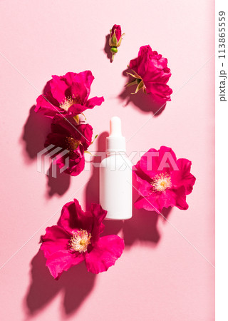 Beauty concept with cosmetic bottle and flowers 113865559