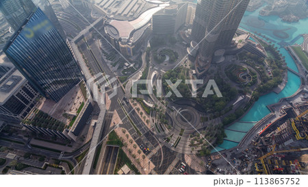 Dubai downtown street with busy traffic and skyscrapers around timelapse. 113865752
