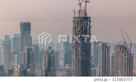 Construction of new modern skyscraper in Dubai city aerial timelapse, United Arab Emirates 113865757