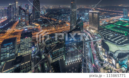 Dubai International Financial Centre district with modern skyscrapers night timelapse 113865771