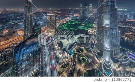 Panoramic skyline view of Dubai downtown with mall, fountains and Burj Khalifa aerial night timelapse 113865773