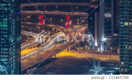 Dubai downtown street with busy traffic and skyscrapers around timelapse. 113865790