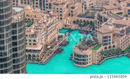Dubai downtown with fountains area near mall and souk timelapse. Dubai downtown with fountains area near mall and souk timelapse. 113865804