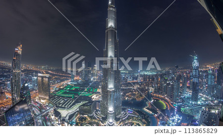 Paniramic skyline view of Dubai downtown with mall, fountains and Burj Khalifa aerial night timelapse 113865829