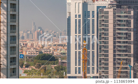 View of new luxury skyscrapers in Dubai city Timelapse Aerial 113865994