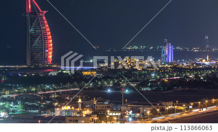 Aerial view of Burj Al Arab hotel from Internet city night timelapse. 113866063