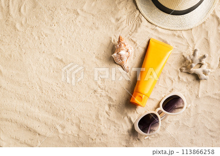 Sunscreen sunblock lotion on sandy beach Sunscreen sunblock lotion on sandy beach 113866258