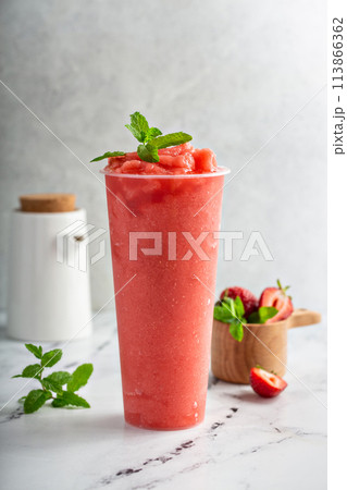 Strawberry watermelon smoothie or slushie in a tall cup Strawberry watermelon smoothie or slushie in a tall cup 113866362