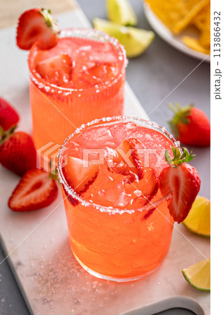 Strawberry margarita with lime, served with chips Strawberry margarita with lime, served with chips 113866432