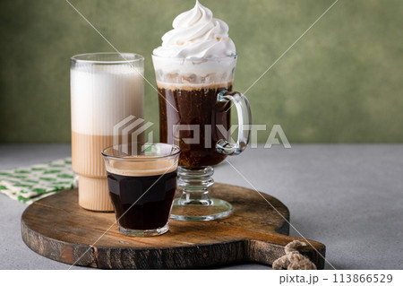 Variety of coffee drinks on green background, Irish coffee 113866529