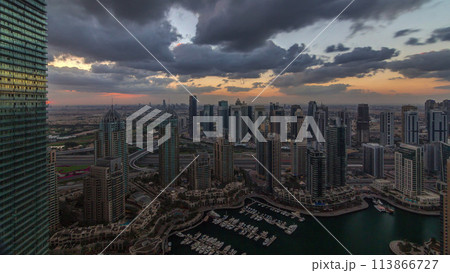 Dubai Marina skyscrapers and jumeirah lake towers view from the top aerial timelapse in the United Arab Emirates. 113866727