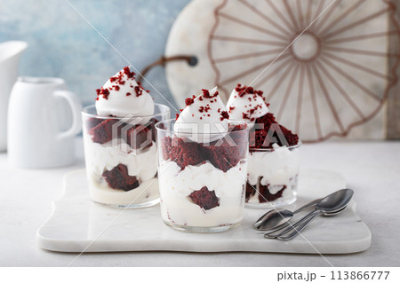 Red velvet layered dessert or parfait in individual glasses 113866777