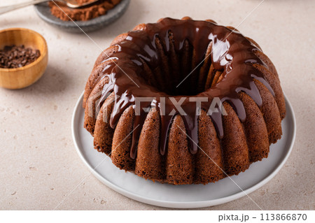 Chocolate marble cake with chocolate ganache made in a bundt pan 113866870