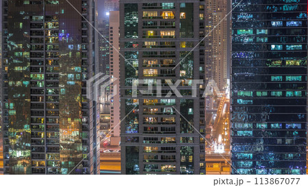 Residential and office buildings in Jumeirah lake towers district night timelapse in Dubai Residential and office buildings in Jumeirah lake towers district night timelapse in Dubai 113867077