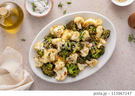 Roasted cauliflower and broccoli on a serving plate, healthy vegetable side dish Roasted cauliflower and broccoli on a serving plate, healthy vegetable side dish 113867147
