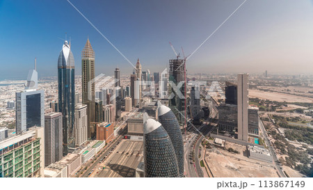 Skyline view of the buildings of Sheikh Zayed Road and DIFC aerial timelapse in Dubai, UAE. Skyline view of the buildings of Sheikh Zayed Road and DIFC aerial timelapse in Dubai, UAE. 113867149