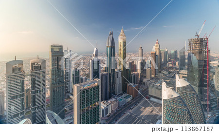 Skyline view of the buildings of Sheikh Zayed Road and DIFC aerial timelapse in Dubai, UAE. Skyline view of the buildings of Sheikh Zayed Road and DIFC aerial timelapse in Dubai, UAE. 113867187