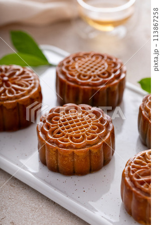 Traditional Chinese mooncakes for mid autumn festival with egg yolk and bean paste filling Traditional Chinese mooncakes for mid autumn festival with egg yolk and bean paste filling 113867258