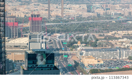 Aerial view to financial and zabeel district timelapse with traffic and under construction building with cranes from downtown Aerial view to financial and zabeel district timelapse with traffic and under construction building with cranes from downtown 113867343