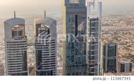 Skyline view of the buildings of Sheikh Zayed Road and DIFC aerial timelapse in Dubai, UAE. 113867345