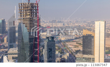 Skyline view of the buildings of Sheikh Zayed Road and DIFC aerial timelapse in Dubai, UAE. 113867347
