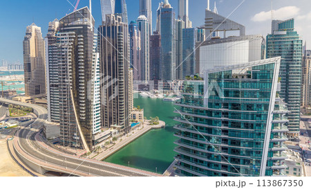 Aerial view of Dubai Marina residential and office skyscrapers with waterfront timelapse 113867350
