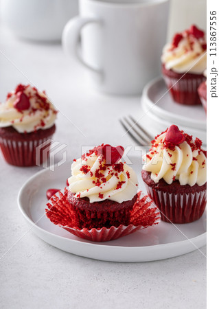 Red velvet cupcakes with cream cheese frosting for Valentines day 113867556