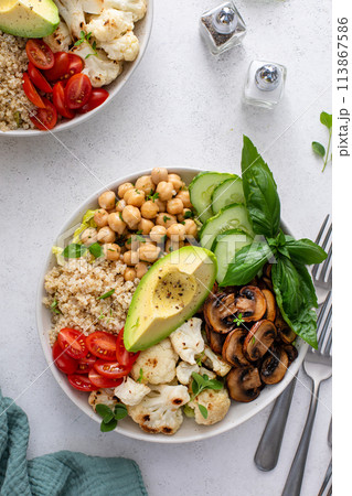 Healthy high protein vegan plant based lunch bowl with mushrooms, roasted cauliflower, chickpeas and quinoa Healthy high protein vegan plant based lunch bowl with mushrooms, roasted cauliflower, chickpeas and quinoa 113867586
