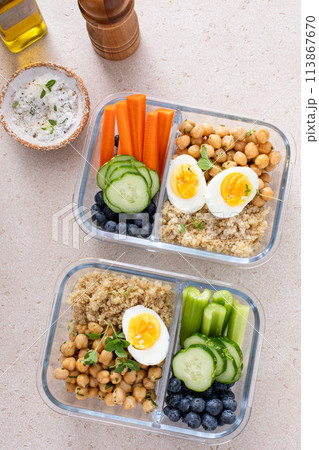 Vegetarian lunch meal prep containers high protein with quinoa, herbed chickpeas, vegetables and eggs Vegetarian lunch meal prep containers high protein with quinoa, herbed chickpeas, vegetables and eggs 113867670