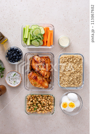 Meal prep containers with healthy food prepped, cooked chicken, quinoa, chickpeas and eggs 113867682