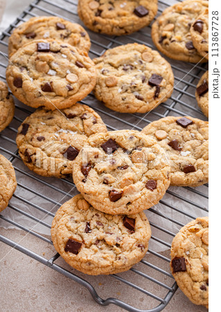 Chocolate chip cookies with chocolate chunks and caramel chips 113867728