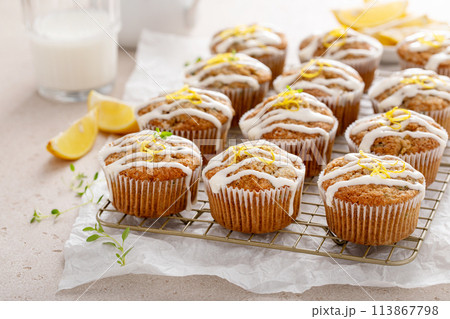 Lemon zucchini muffins drizzled with sugar glaze 113867798